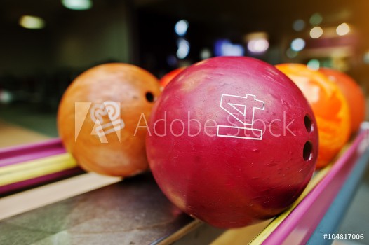 Picture of Two colored bowling balls of number 14 and 13